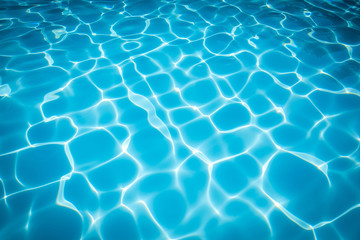 Wonderful blue and bright ripple water and surface in swimming pool, Beautiful motion gentle wave in pool