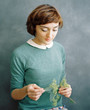 © Duet Postscriptum/Stocksy - Pretty elegant woman with branch
