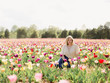 © Marta Locklear/Stocksy - Girl in a Field of Flowers