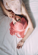 © Sergey Filimonov/Stocksy - Portrait of woman with pink hair