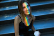© Good Vibrations Images/Stocksy - Beautiful woman with a colorful ray of light