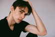 © Liliya Rodnikova/Stocksy - Young handsome brunet looking at camera