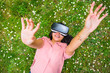 © Giorgio Magini/Stocksy - Teen with VR Glasses Outdoors in Springtime