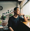 © Maa Hoo/Stocksy - Portrait of coffee shop owner