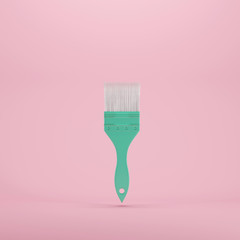 Wall Mural - paint brush floating on pastel color background. minimal idea concept.