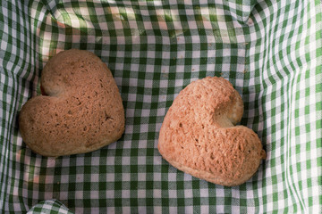 two sweet brown heart cookies in basket close