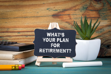 What's Your Plan for Retirement. small wooden board with chalk on the table.