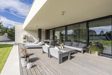 Grey garden furniture on board floor