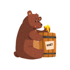 Wall Mural - funny brown bear eating honey from wooden barrel. cartoon forest animal with short tail, small ears 