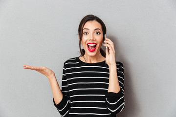 Sticker - Portrait of a cheerful woman talking on mobile phone