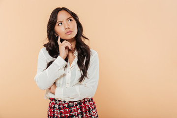 Poster - Portrait of a pensive asian woman standing