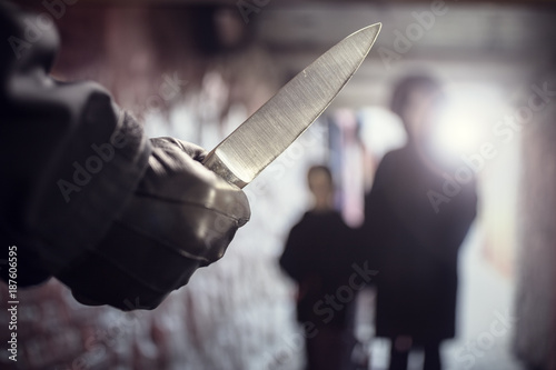 Cuadros en Lienzo Criminal with knife weapon threatening woman in underpass crime