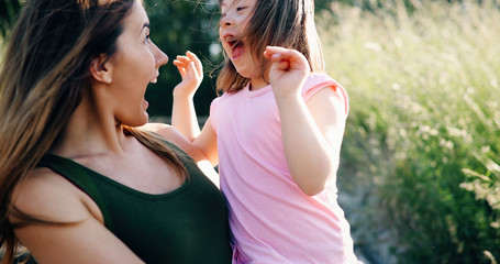 Little girl with special needs enjoy spending time with mother