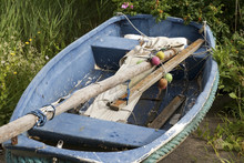 Blue Rowing Boat With Oars