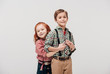 © LIGHTFIELD STUDIOS - adorable little kids hugging and smiling at camera isolated on grey