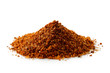 A pile of a red bbq spice mix ioslated on white.