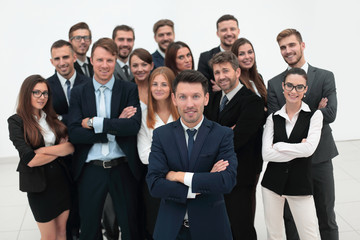 Poster - leader standing in front of a large business team