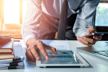 Businessman working with smart phone and digital tablet