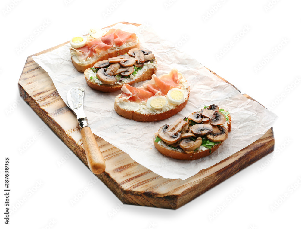 Board with toasts, quail eggs, mushrooms and bacon on board, isolated on white