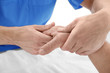 © Africa Studio - Physiotherapist giving hand massage to senior patient, closeup