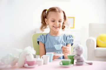 Canvas Print - Cute little girl playing at home