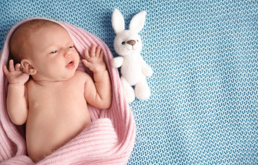 Wall Mural - Cute newborn baby girl lying on plaid