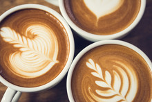Top View Of Beautiful Latte Art Coffee, Rosetta Pattern, In The Cups