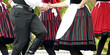 © Zoltan - Folk dancer boys and girls in black, red and white - thematic background