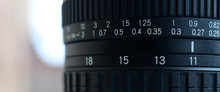 Fragment Of A Wide Angle Zoom Lens For A Modern SLR Camera. The Set Of Distance Values Is Indicated By White Numbers On The Black Body