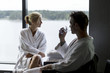 © Scandinav - Couple sitting by the window in the spa