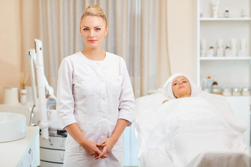 Wall Mural - cosmetologist is a professional with a patient in the office of a medical clinic.
