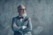 © deagreez - Portrait of modern luxurious trendy wealthy intelligent dreamy pensive stylish authoritative clever man wearing checkered grey jacket chic maroon bow-tie imagine smth, isolated on concrete background