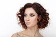 © sergeyzapotylok - Close up beauty studio shot of beautiful redhead woman with gorgeous makeup curly hair