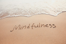 Mindfulness Concept, Mindful Living, Text Written On The Sand Of Beach