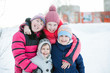 © DariaTrofimova - four joyful sisters on  street in   winter.