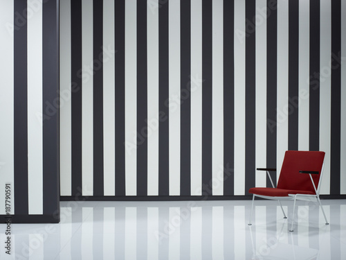 Red Armchair By Black And White Striped Wall This Stock Photo Red Armchair By Black And White Striped Wall
