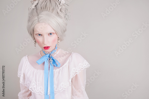 A Blonde Woman With A Beautiful Luxurious Rococo Haircut In