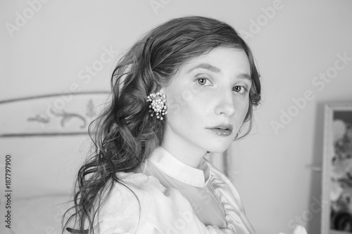 Portrait Of A Woman With Long Red Curly Hair In A White