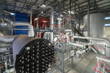 Equipment, cables and piping as found inside of a industrial power plant