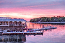 Downtown Bar Harbor Village In Summer During Bright Red Sunset Twilight With Waterfront Restaurant, Pier
