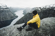 © Alexey Karamanov/Blend Images - Caucasian man on cliff admiring scenic view of mountain river
