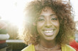 © Peathegee Inc/Blend Images - Sun beams on face of smiling black woman