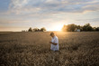 © John Fedele/Blend Images - Farmer examining wheat in field