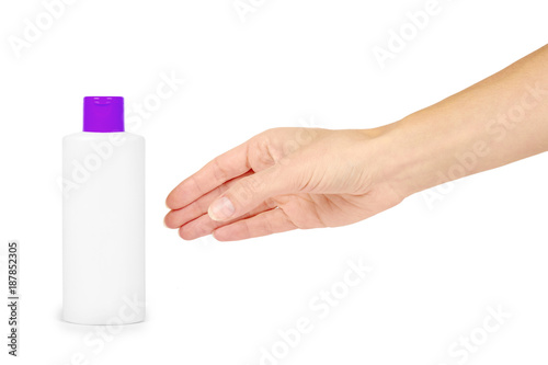 Plastic White Shampoo Bottle With Orange Cap In Hand Isolated On