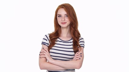 Poster - Pretty young cheerful redhead lady looking camera isolated over white wall background with arms crossed