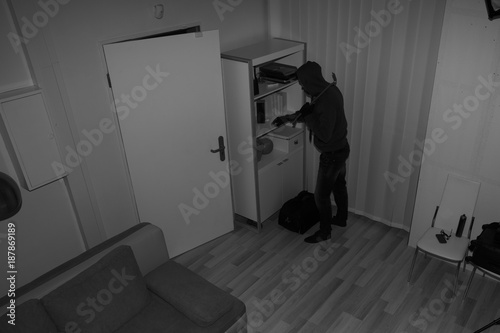 Cuadros en Lienzo Robber Searching House For Valuables