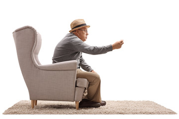 Poster - Angry senior sitting in an armchair and arguing