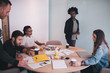 © Criene Images - Team of young business people brainstorming in meeting