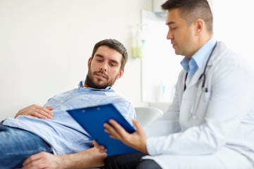 Wall Mural - doctor and man with health problem at hospital