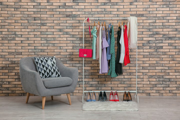 Wall Mural - Rack with collection of clothes in dressing room